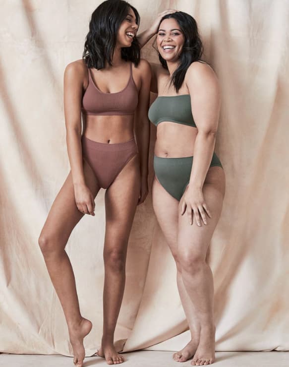2 black women smiling and modelling seam free underwear from Target.